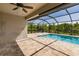 Spacious pool area with screened enclosure and adjacent patio at 27261 Guapore Dr, Punta Gorda, FL 33983
