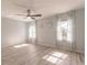 Well-lit bedroom featuring wood-look floors and window curtains at 27261 Guapore Dr, Punta Gorda, FL 33983