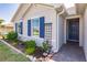 House exterior showcasing a front door and landscaping at 27261 Guapore Dr, Punta Gorda, FL 33983