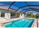 Relaxing screened-in pool with a large patio area at 27261 Guapore Dr, Punta Gorda, FL 33983