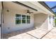 Covered patio with tile flooring and ceiling fan, offering shade and comfort at 27261 Guapore Dr, Punta Gorda, FL 33983