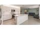 Open concept kitchen with white cabinets, stainless steel appliances, and island at 27261 Guapore Dr, Punta Gorda, FL 33983