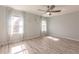 Bright bedroom with ceiling fan and wood-look floors at 27261 Guapore Dr, Punta Gorda, FL 33983