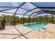 Relaxing screened-in pool with a large patio area at 27261 Guapore Dr, Punta Gorda, FL 33983