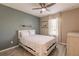 Bedroom with large window and ceiling fan at 27261 Guapore Dr, Punta Gorda, FL 33983