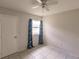 Bright bedroom featuring tile floors and ceiling fan at 600 Beeche Nw Ter, Port Charlotte, FL 33948