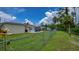 Fenced yard with green space offering privacy and access to outdoor enjoyment and entertainment at 2256 Auburn Blvd, Port Charlotte, FL 33948