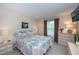Bright bedroom featuring a large window, neutral-toned walls, and coastal-themed decor accents at 2256 Auburn Blvd, Port Charlotte, FL 33948