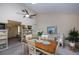 Bright dining area with a skylight, ceiling fan and a dining table for six at 2256 Auburn Blvd, Port Charlotte, FL 33948
