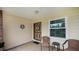 Inviting front porch with a decorative wreath and a comfortable seating area at 2256 Auburn Blvd, Port Charlotte, FL 33948