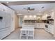 Modern kitchen with white cabinets, stainless appliances, and center island at 2256 Auburn Blvd, Port Charlotte, FL 33948