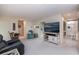 Spacious open living room with neutral color palette and seamless access to the kitchen at 2256 Auburn Blvd, Port Charlotte, FL 33948