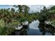 Waterfront view featuring lush greenery and private boat docks at 2256 Auburn Blvd, Port Charlotte, FL 33948