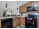 Modern kitchen with black appliances and wood cabinets at 7457 W Lenox Cir, Punta Gorda, FL 33950