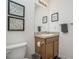 Clean bathroom with a vanity, toilet, and relaxing decor at 7457 W Lenox Cir, Punta Gorda, FL 33950