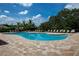 Relaxing community pool with lounge chairs and shaded areas at 7457 W Lenox Cir, Punta Gorda, FL 33950