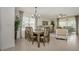 Bright dining area with a table and chairs, near living room at 7457 W Lenox Cir, Punta Gorda, FL 33950