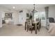 Dining area with view into bedroom and entryway at 7457 W Lenox Cir, Punta Gorda, FL 33950