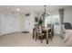 Dining area with view into entryway and bedroom at 7457 W Lenox Cir, Punta Gorda, FL 33950