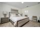 Comfortable bedroom with a queen-size bed and ensuite bathroom at 7457 W Lenox Cir, Punta Gorda, FL 33950