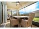 Outdoor screened patio with table and chairs, perfect for dining al fresco at 7457 W Lenox Cir, Punta Gorda, FL 33950