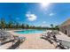Relax and enjoy the community pool with plenty of lounge chairs at 7457 W Lenox Cir, Punta Gorda, FL 33950