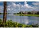 Serene community lake featuring a water fountain at 7457 W Lenox Cir, Punta Gorda, FL 33950