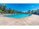 Large, refreshing pool with surrounding lounge area at 7457 W Lenox Cir, Punta Gorda, FL 33950