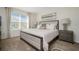 Large main bedroom with a king-size bed and plenty of natural light at 7457 W Lenox Cir, Punta Gorda, FL 33950