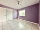 Spacious bedroom with tile floors and a ceiling fan at 2673 Greendale Rd, North Port, FL 34287
