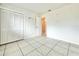 Simple bedroom with tile floors and a closet at 2673 Greendale Rd, North Port, FL 34287