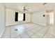 Bright living room with tile floors and a ceiling fan at 2673 Greendale Rd, North Port, FL 34287