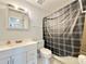 Bathroom with shower, toilet and white vanity at 2673 Greendale Rd, North Port, FL 34287