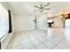 Bright living room with tile floors and a ceiling fan at 2673 Greendale Rd, North Port, FL 34287