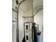 Garage with water heater and water softener at 2673 Greendale Rd, North Port, FL 34287