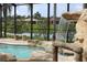 Tranquil pool and spa with a cascading waterfall and lake views at 6913 Talon Bay Dr, North Port, FL 34287