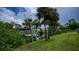 Serene waterfront view, featuring a private boat dock and tranquil canal at 2256 Auburn Blvd, Port Charlotte, FL 33948