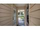 Convenient backyard access through a gate, leading to a spacious patio at 2256 Auburn Blvd, Port Charlotte, FL 33948
