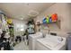 Laundry room with washer, dryer, and ample storage at 2256 Auburn Blvd, Port Charlotte, FL 33948