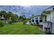 Relaxing backyard patio with lush grass, offering a peaceful outdoor space at 2256 Auburn Blvd, Port Charlotte, FL 33948