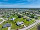 Aerial view of single-Gathering home with large backyard at 6420 Drucker Cir, Port Charlotte, FL 33981