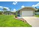Single-Gathering home with two-car garage and landscaped yard at 20222 Banner Ave, Port Charlotte, FL 33952