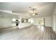 Open living room with kitchen, vaulted ceiling, and vinyl plank flooring at 20222 Banner Ave, Port Charlotte, FL 33952