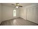 Charming bedroom with double doors and ceiling fan at 20222 Banner Ave, Port Charlotte, FL 33952