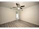 Spacious bedroom with ceiling fan and door to exterior at 20222 Banner Ave, Port Charlotte, FL 33952