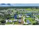 Aerial view of waterfront community with lush landscaping and numerous homes at 29165 Orva Dr, Punta Gorda, FL 33982