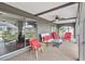 Spacious screened porch with wicker furniture at 108 Boundary Blvd # A&B, Rotonda West, FL 33947