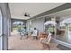 Relaxing screened porch with outdoor seating and access to the backyard at 108 Boundary Blvd # A&B, Rotonda West, FL 33947