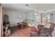 Living room features wicker chairs, sofa and coffee table at 108 Boundary Blvd # A&B, Rotonda West, FL 33947