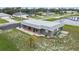 Gray house with spacious yard near a lake and bridge at 108 Boundary Blvd # A&B, Rotonda West, FL 33947